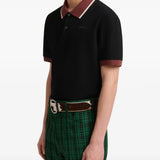 Black t-shirt worn by a person, showing the t-shirt fit