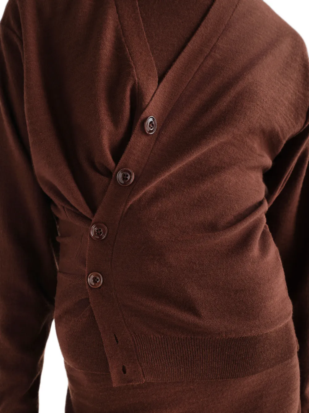 Brown knitwear worn by a person, showing the knitwear fit