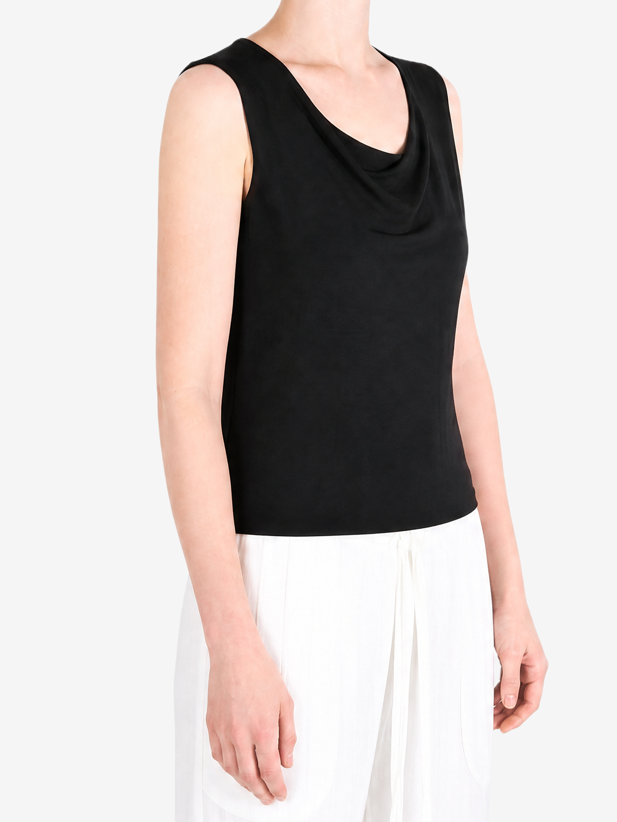 Black top worn by a person, showing the top fit