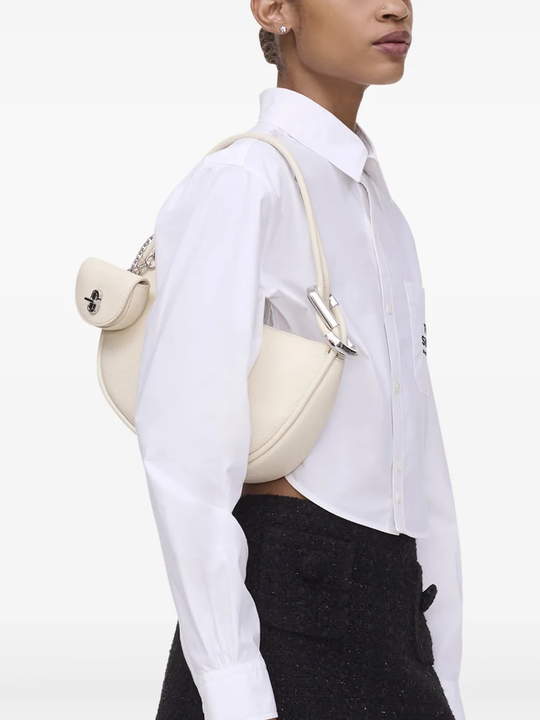 White bag worn by a person, showing the bag fit
