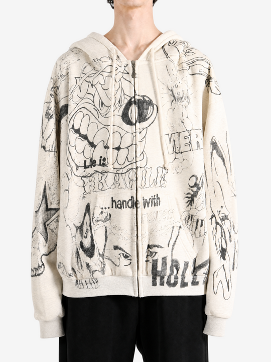 Tan hoodie worn by a person, showing the hoodie fit