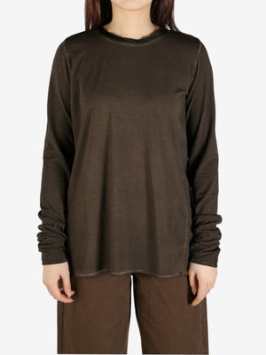 Brown top worn by a person, showing the top's fit
