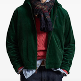 Green windbreaker worn by a person, showing the windbreaker's fit