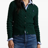 Green cardigan worn by a person, showing the cardigan's fit