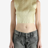 green pleated top worn by a person, showing the top fit