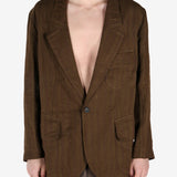 Brown jacket worn by a person, showing the jacket's fit