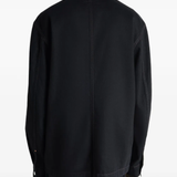 Black jacket worn by a person, showing the jacket's fit