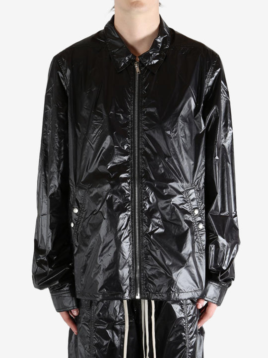 Black jacket worn by a person, showing the jacket's fit