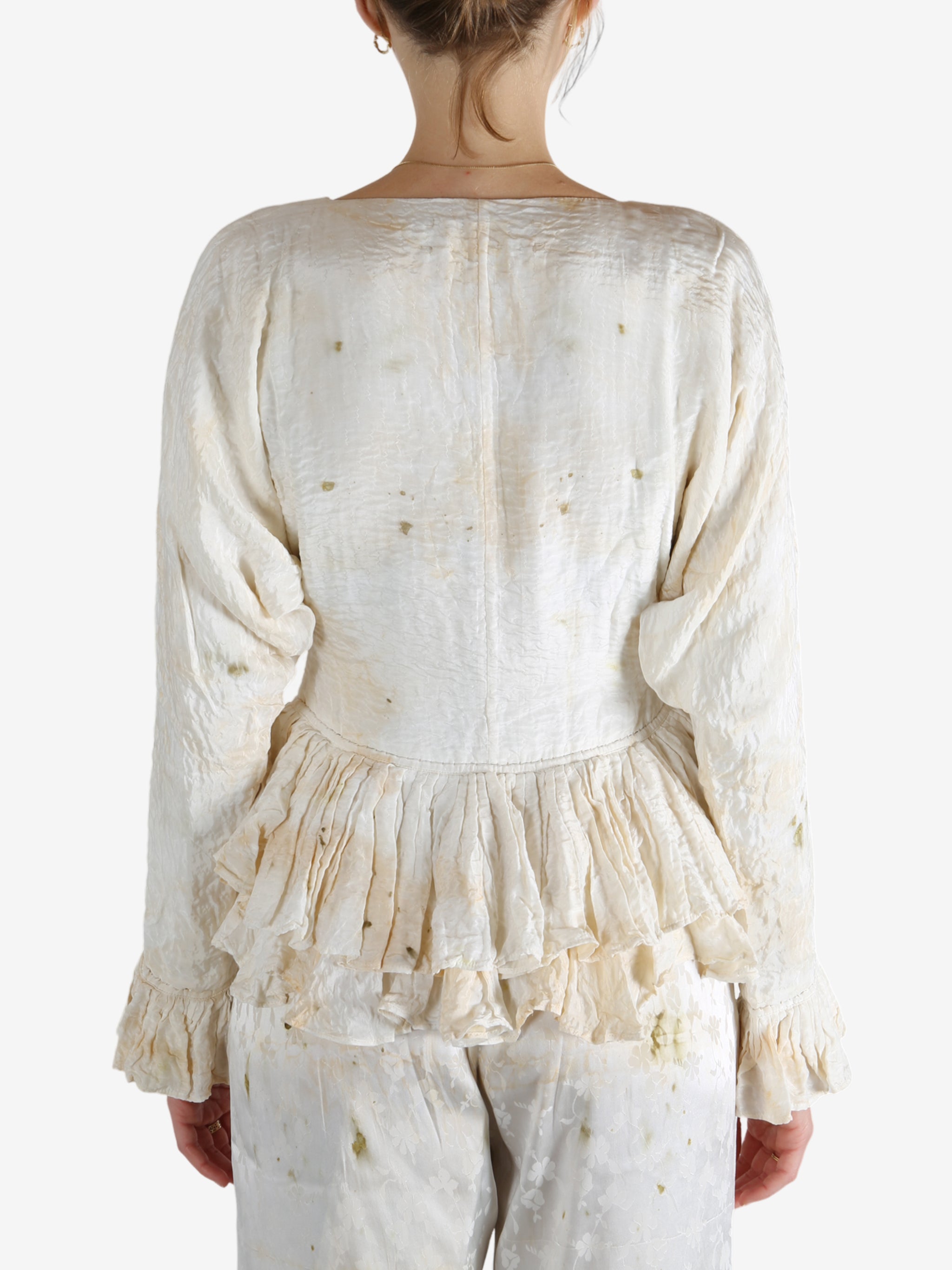 White tops worn by a person, showing the tops's fit