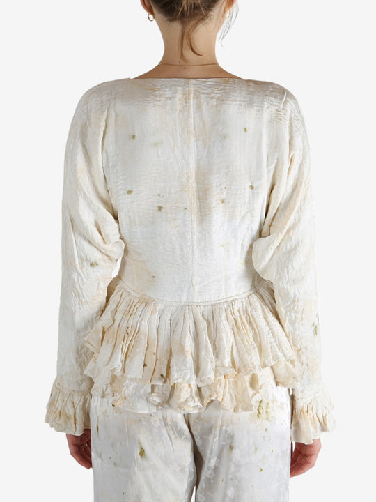 White tops worn by a person, showing the tops's fit