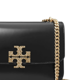 Close up of black bag, showing the detail of the gold-tone chain
