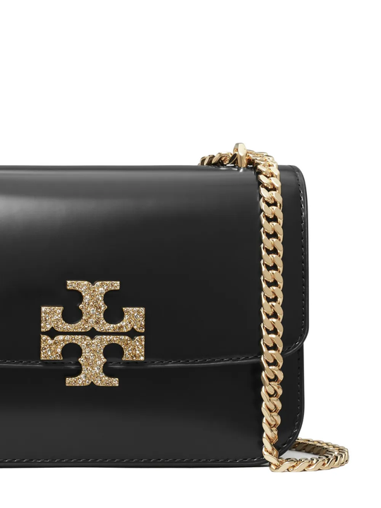 Close up of black bag, showing the detail of the gold-tone chain