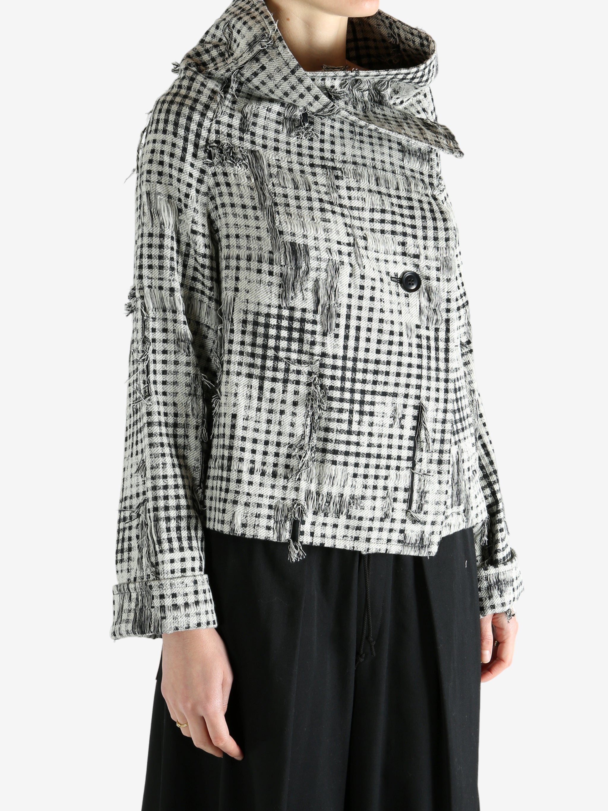 Black jackets worn by a person, showing the jackets fit