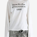 White t-shirt worn by a person, showing the t-shirt fit