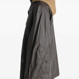 Brown jacket worn by a person, showing the jacket's  fit
