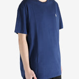 Navy blue t-shirt worn by a person, showing the shirt's fit