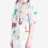 White shirt worn by a person, showing the shirt fit