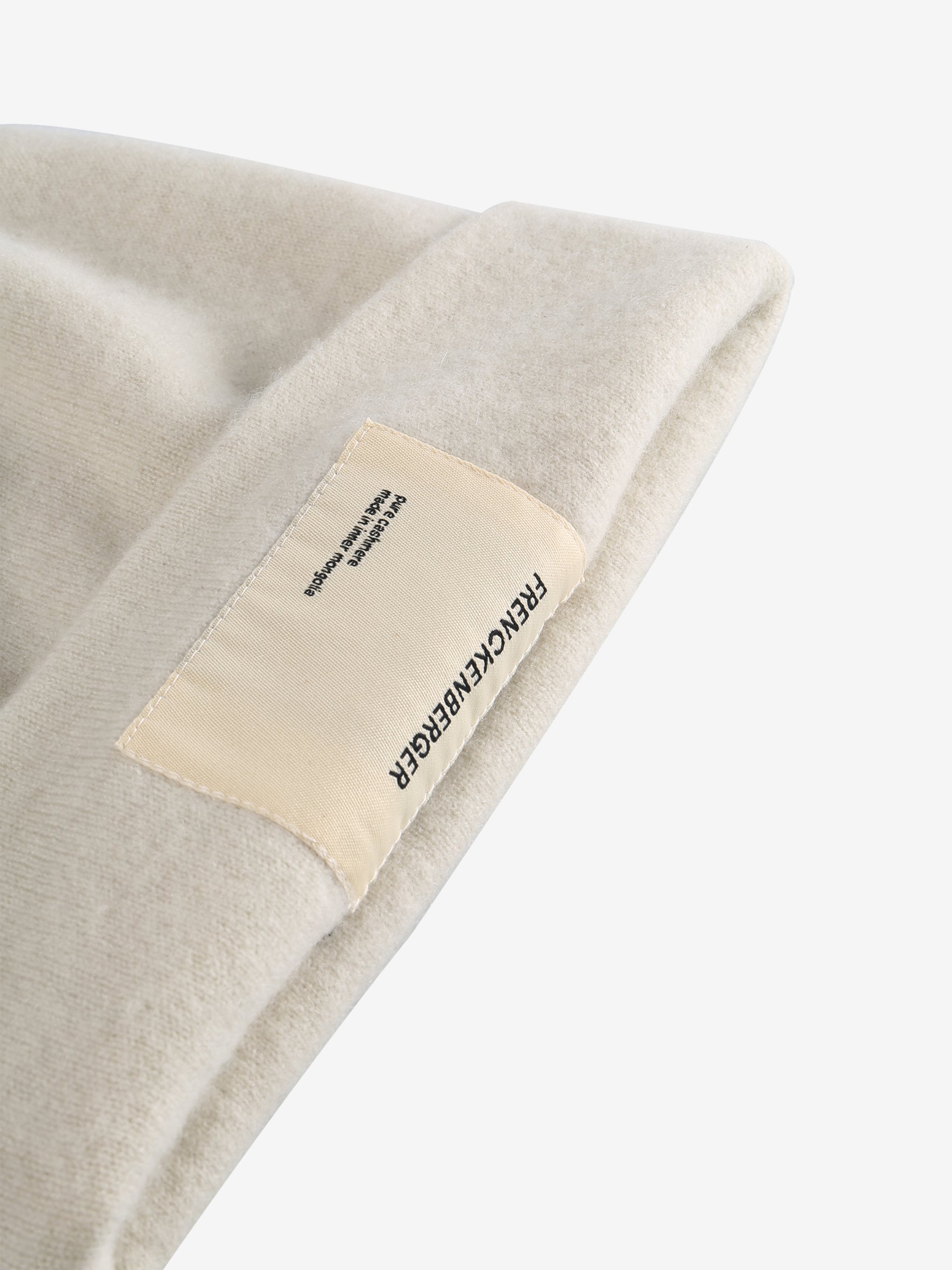 Close up of tan hats, showing texture of the wool fabric