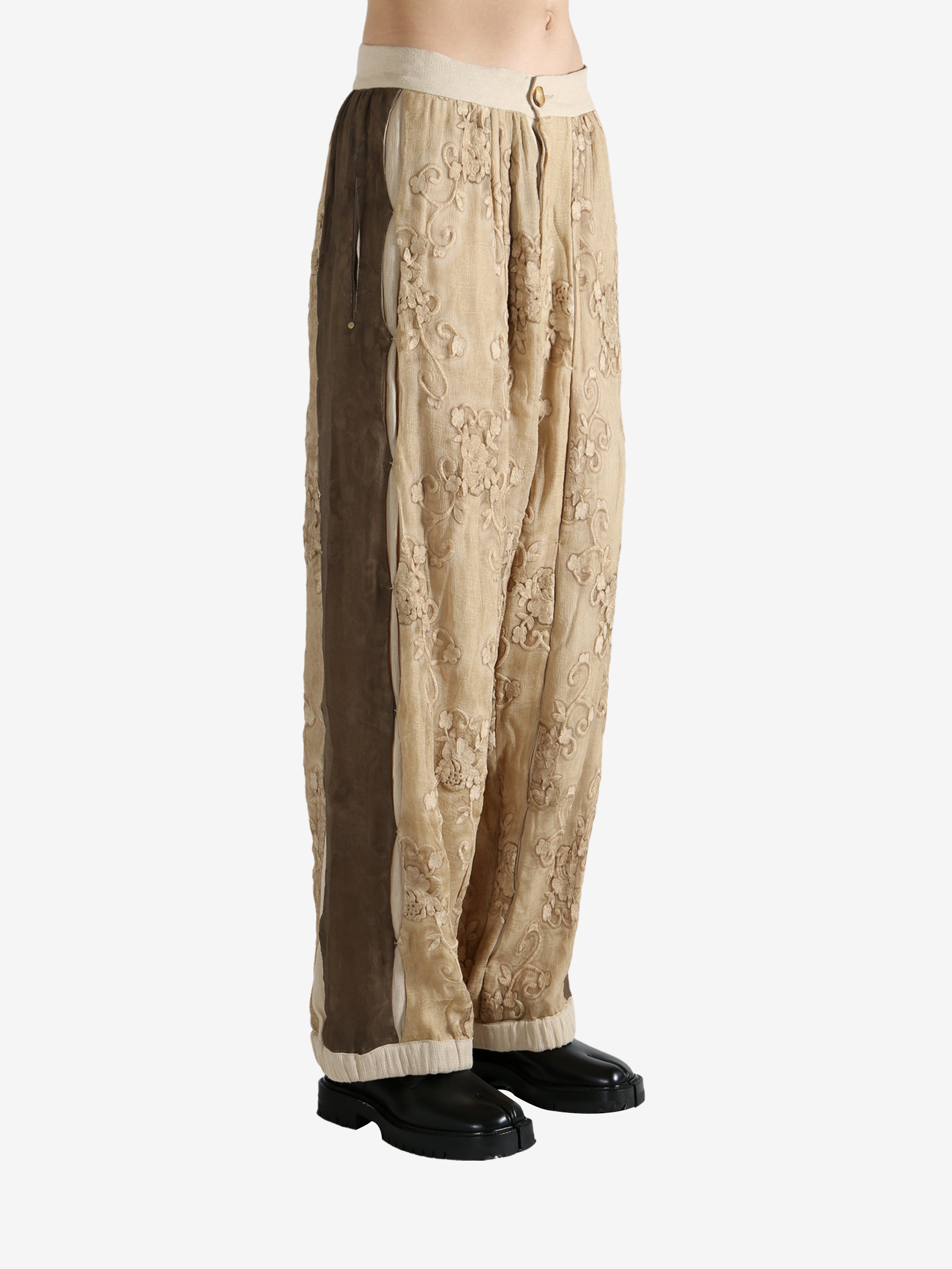 Tan pants worn by a person, showing the pants fit