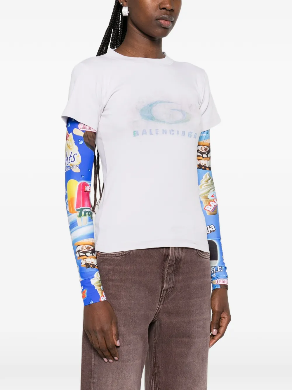 white t-shirt worn by a person, showing the t-shirt fit