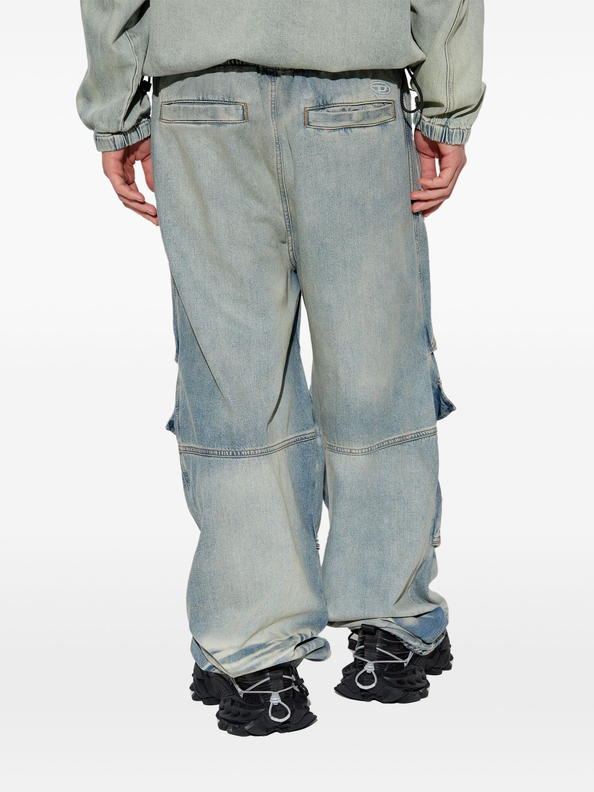 Blue pants worn by a person, showing the pants fit