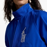 Blue jacket worn by a person, showing the jacket fit