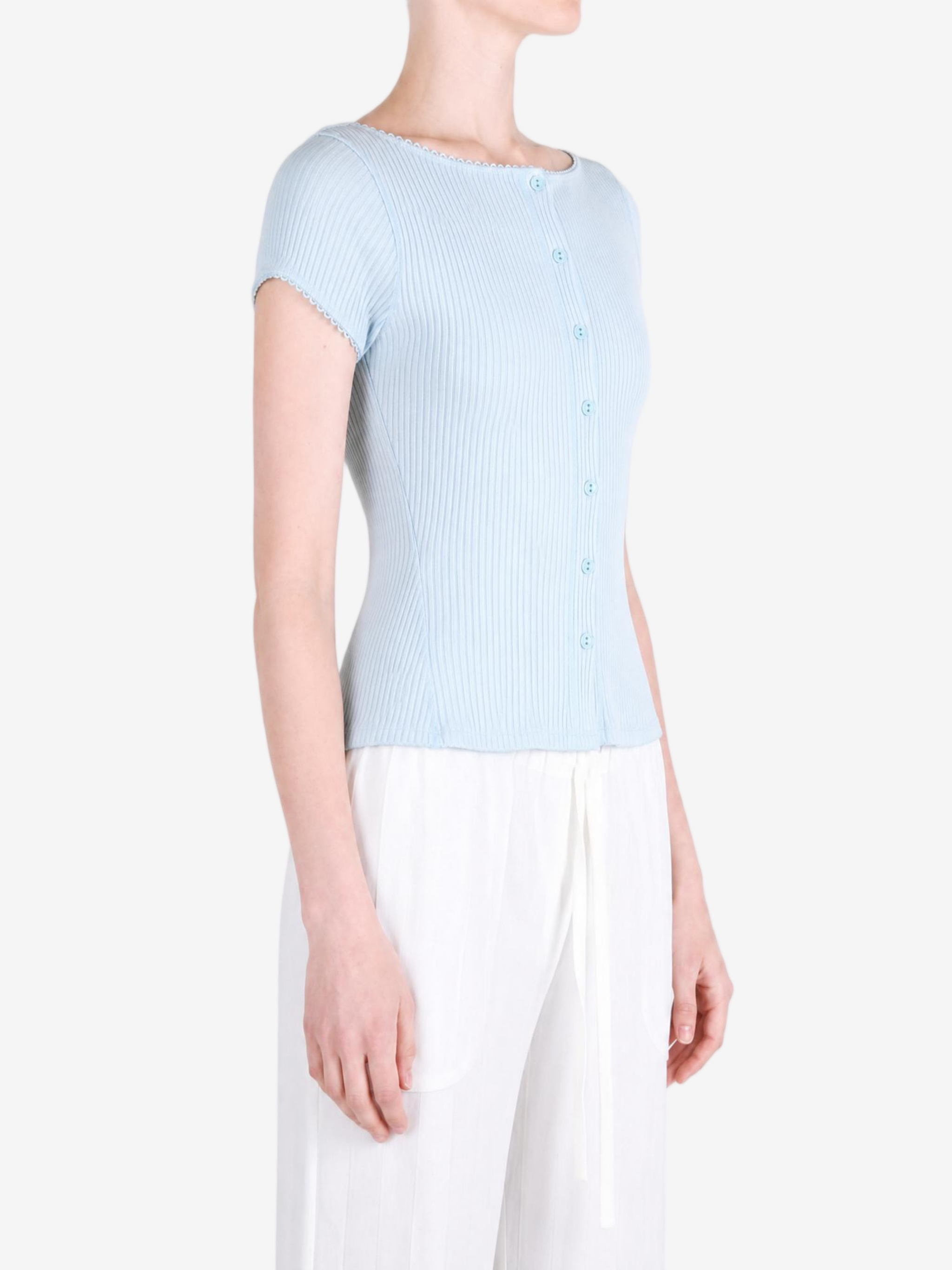 Blue knitwear worn by a person, showing the knitwear fit