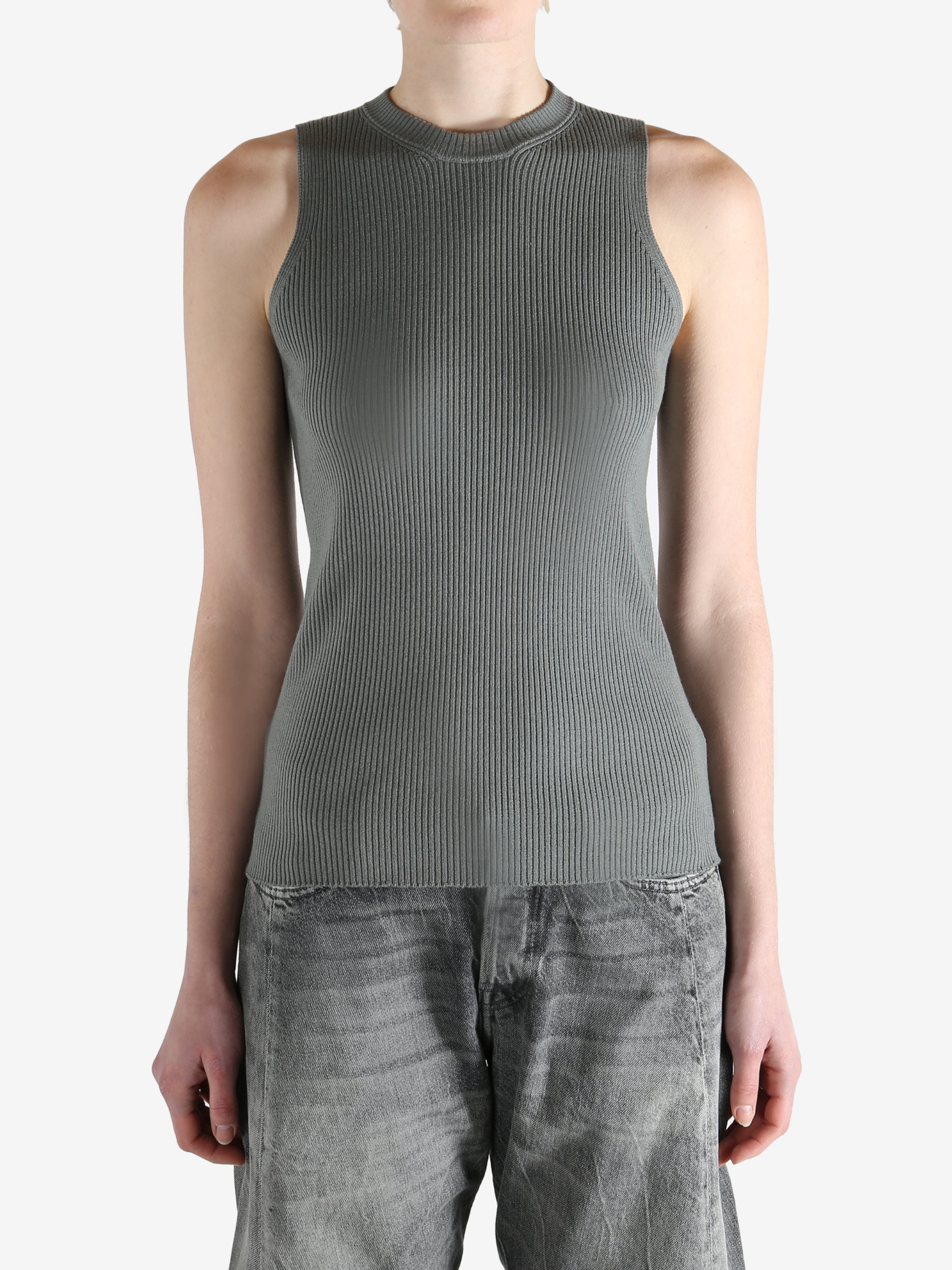 Grey tops worn by a person, showing the tops fit
