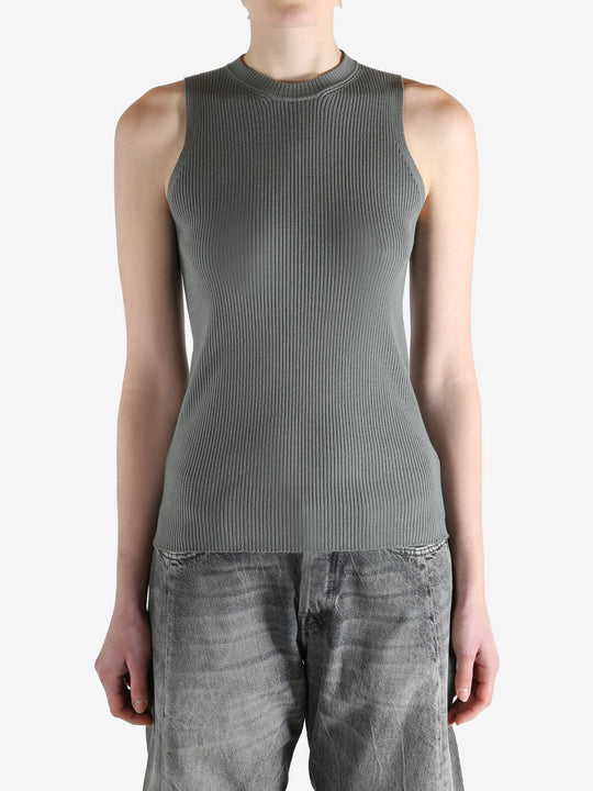 Grey tops worn by a person, showing the tops fit