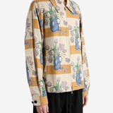 Tan jacket worn by a person, showing the jacket fit
