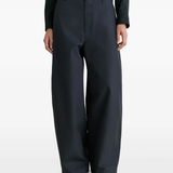 Navy pants worn by a person, showing the pants fit