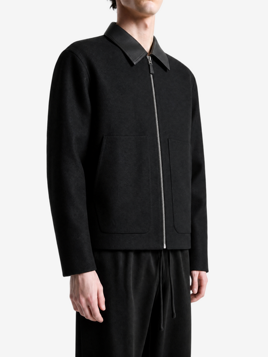 Black top worn by a person, showing the top fit
