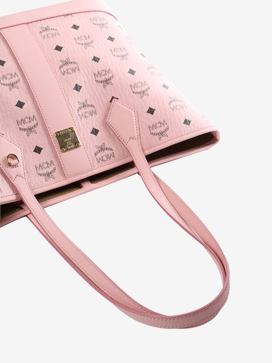 Close up of pink bag, showing texture of the fabric