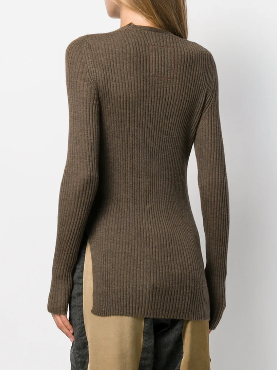 Brown sweater worn by a person, showing the tight fit