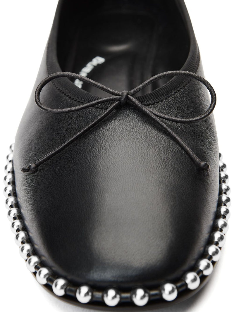 Close up of black shoes, showing texture of the lambskin fabric