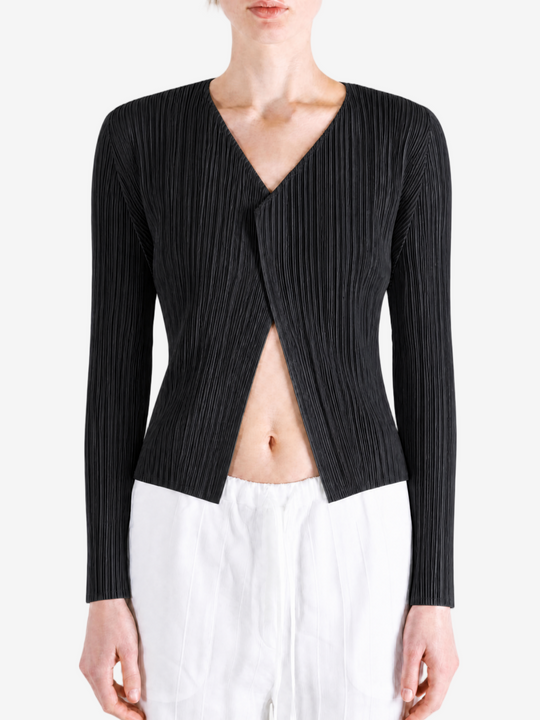 Black knitwear worn by a person, showing the knitwear fit