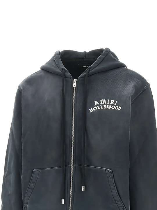 Close up of the black hoodie, showing texture of the cotton fabric