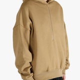 Brown hoodie worn by a person, showing the hoodie's fit