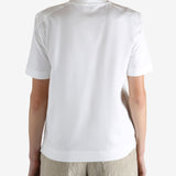 White t-shirt worn by a person, showing the t-shirt fit
