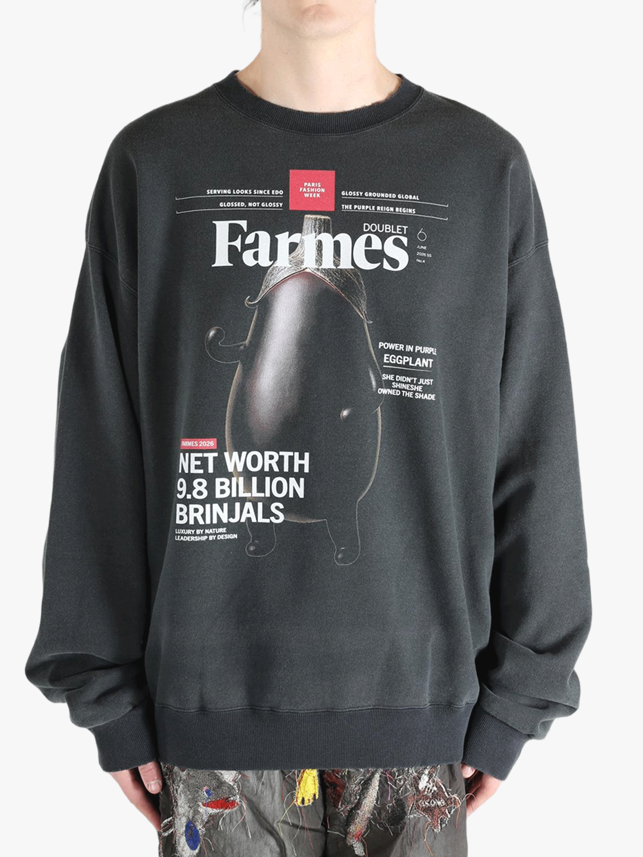 Black shirt worn by a person, showing the shirt's fit