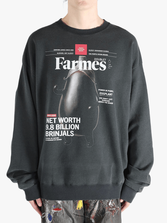 Black shirt worn by a person, showing the shirt's fit