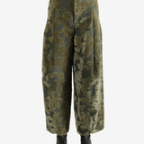 Green pants worn by a person, showing the pants' fit