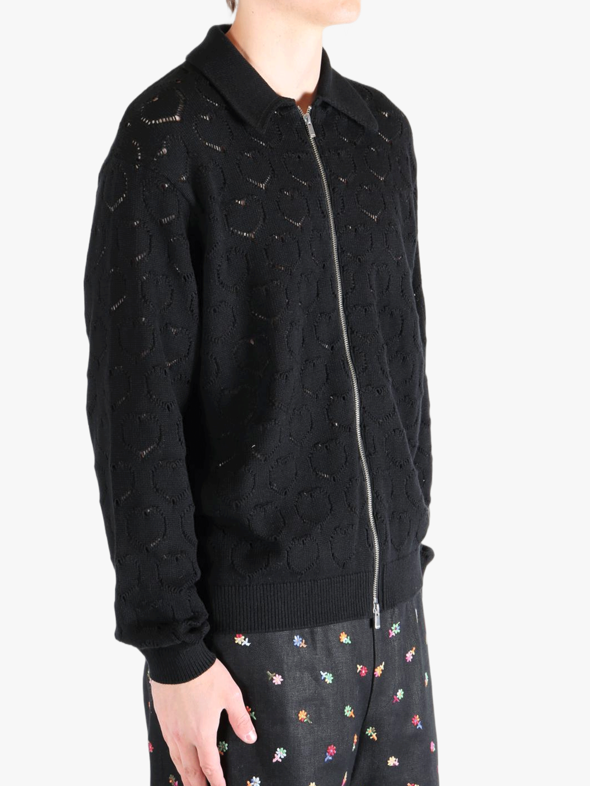 Black jackets worn by a person, showing the jackets fit