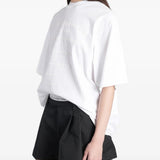 White t-shirt worn by a person, showing the t-shirt fit