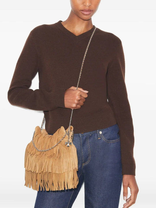 Tan bags worn by a person, showing the bags fit