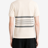 Tan shirt worn by a person, showing the shirt fit
