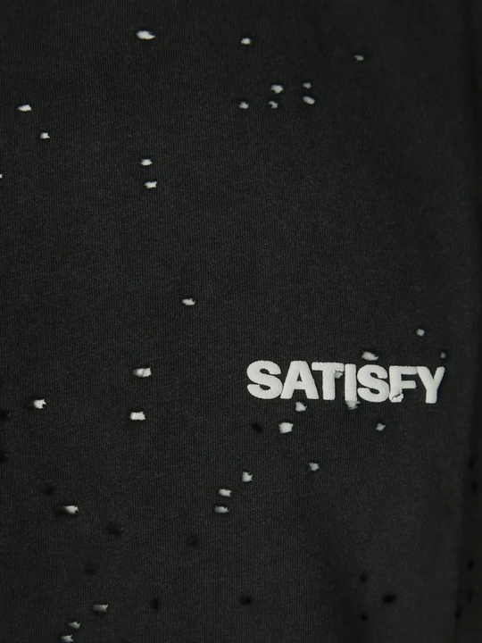 Close up of black shirt, showing texture of the cotton fabric