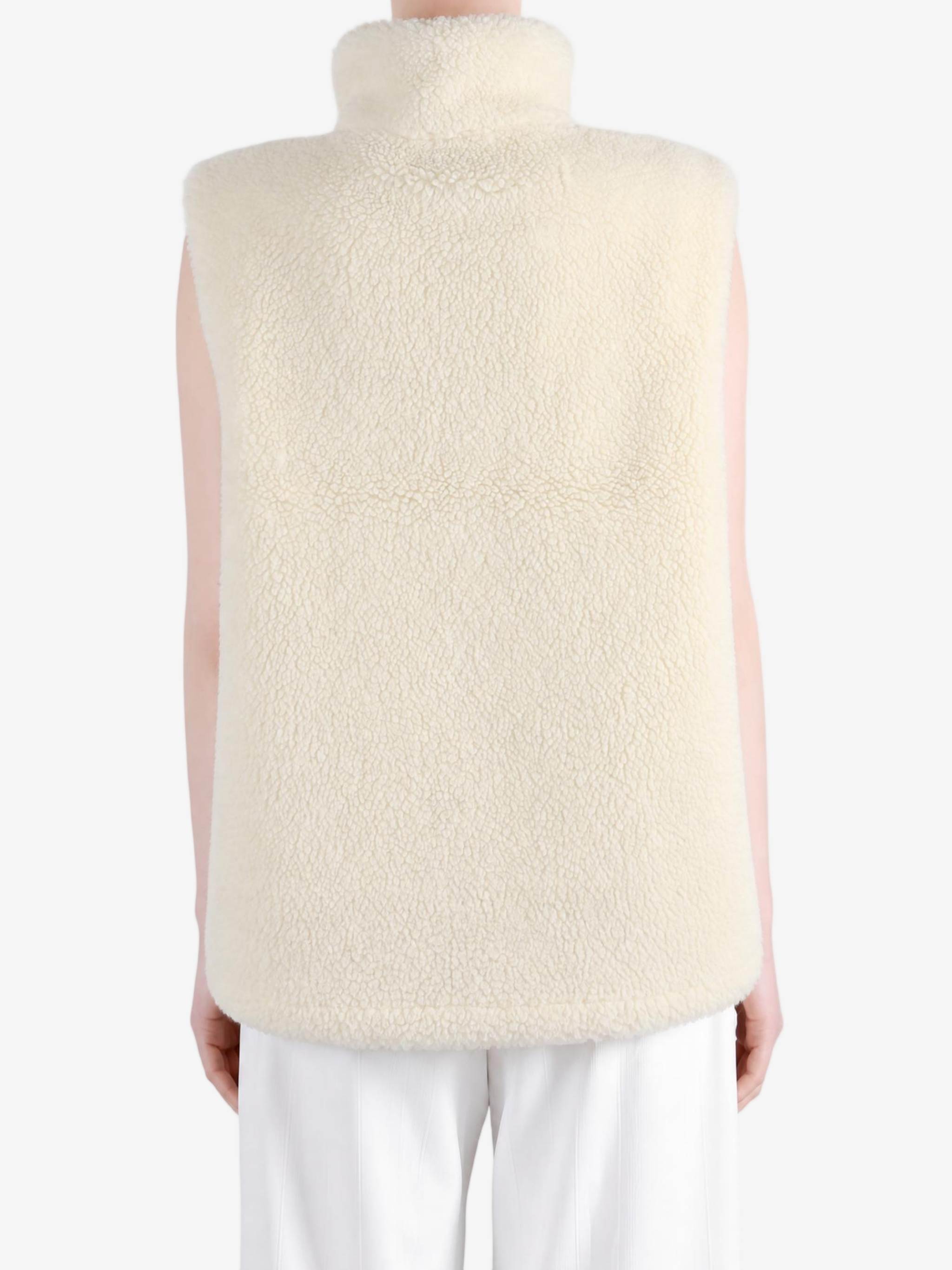 Tan top worn by a person, showing the top fit