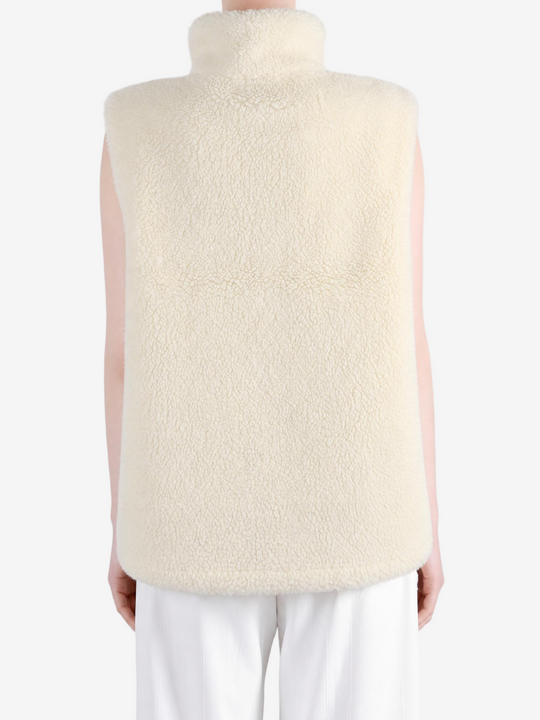 Tan top worn by a person, showing the top fit