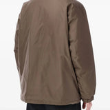 Brown jackets worn by a person, showing the jackets fit